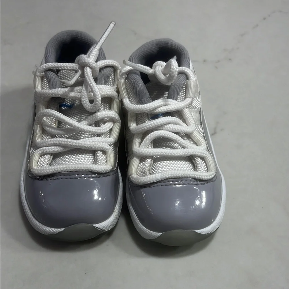 Gray and White Jordan 11 Low Sneakers